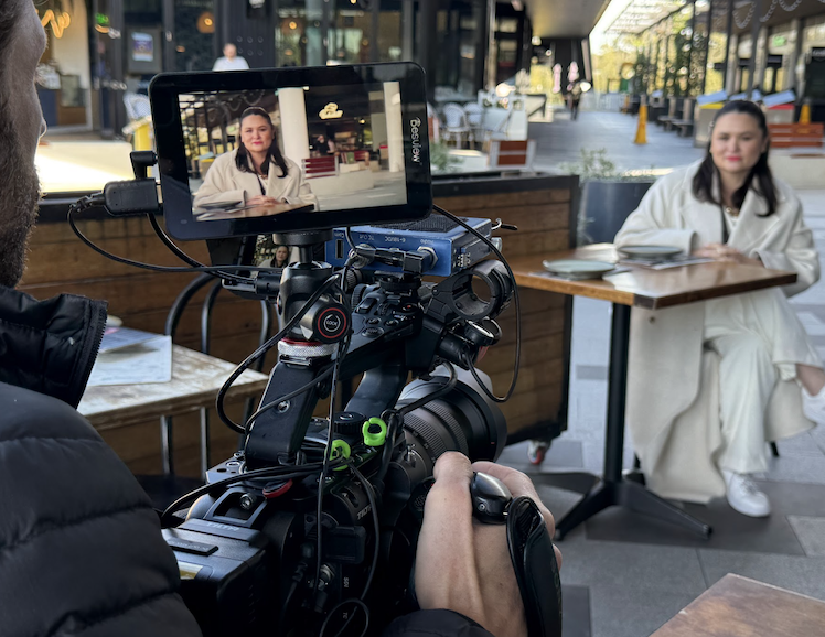 On Location: A quiet table, warm morning light, and the hum of a café created the perfect setting for an on-camera chat.