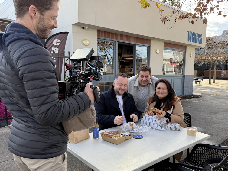 Candid Moments: Smiles, bites, and plenty of good energy as the crew blended filming with friendly chatter.